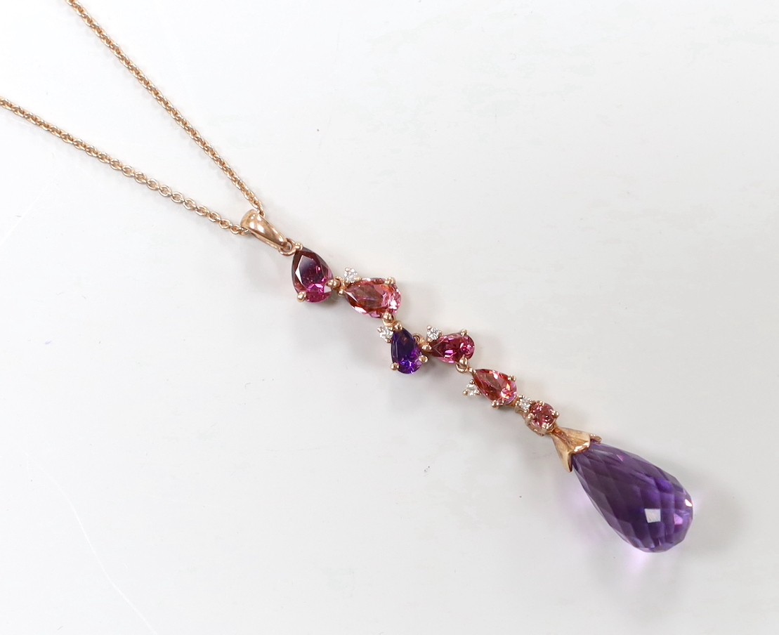 A modern 9ct gold, garnet, topaz, amethyst and diamond chip set drop pendant necklace, pendant 46mm, chain 46cm, gross weight 4.7 grams.